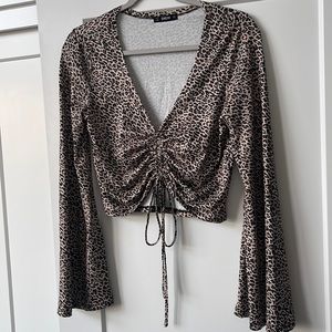 NWT cheetah print flared long sleeve top with ruched tie crop top